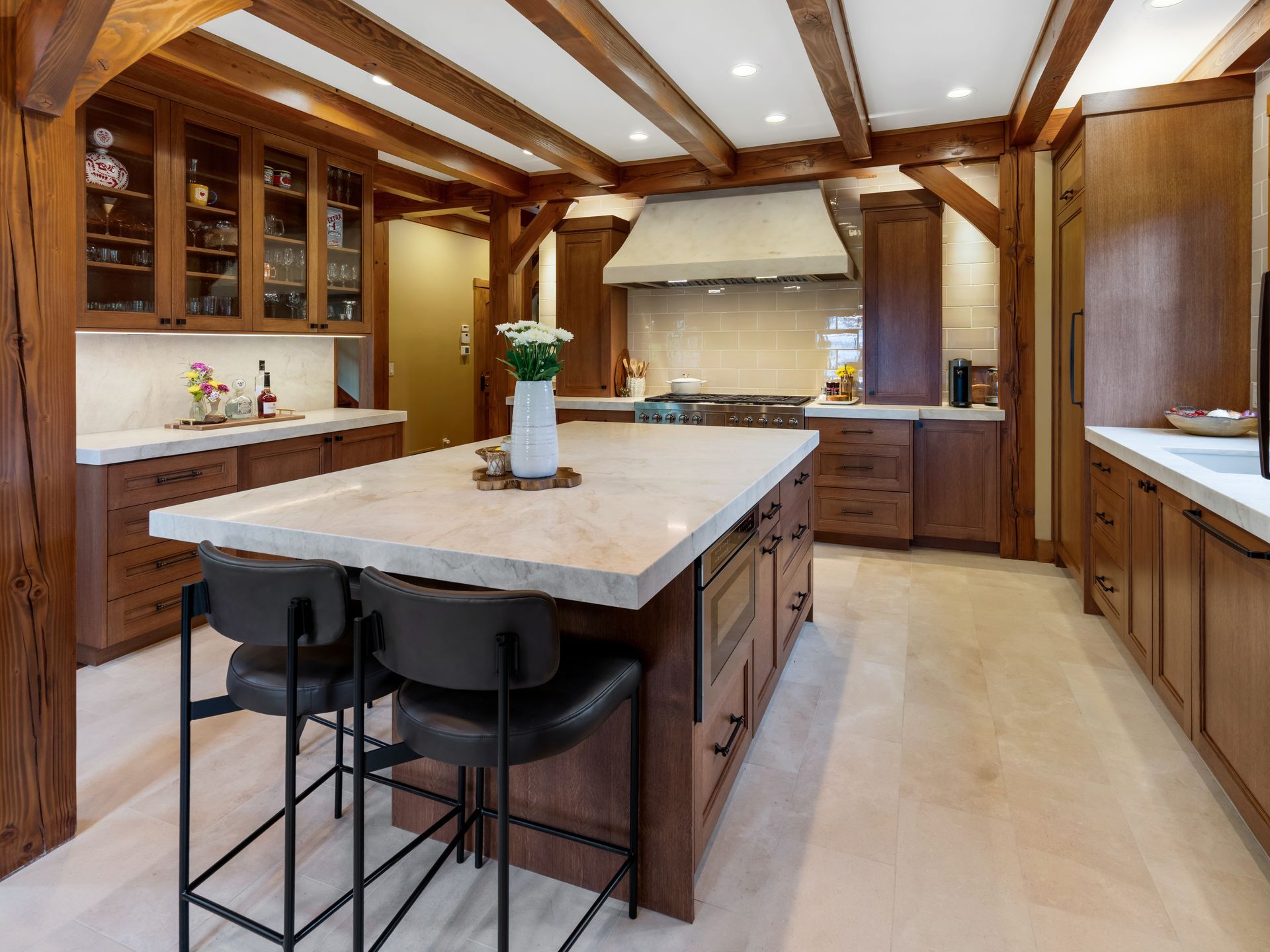 Open-concept luxury kitchen with oversized island and stone countertops
