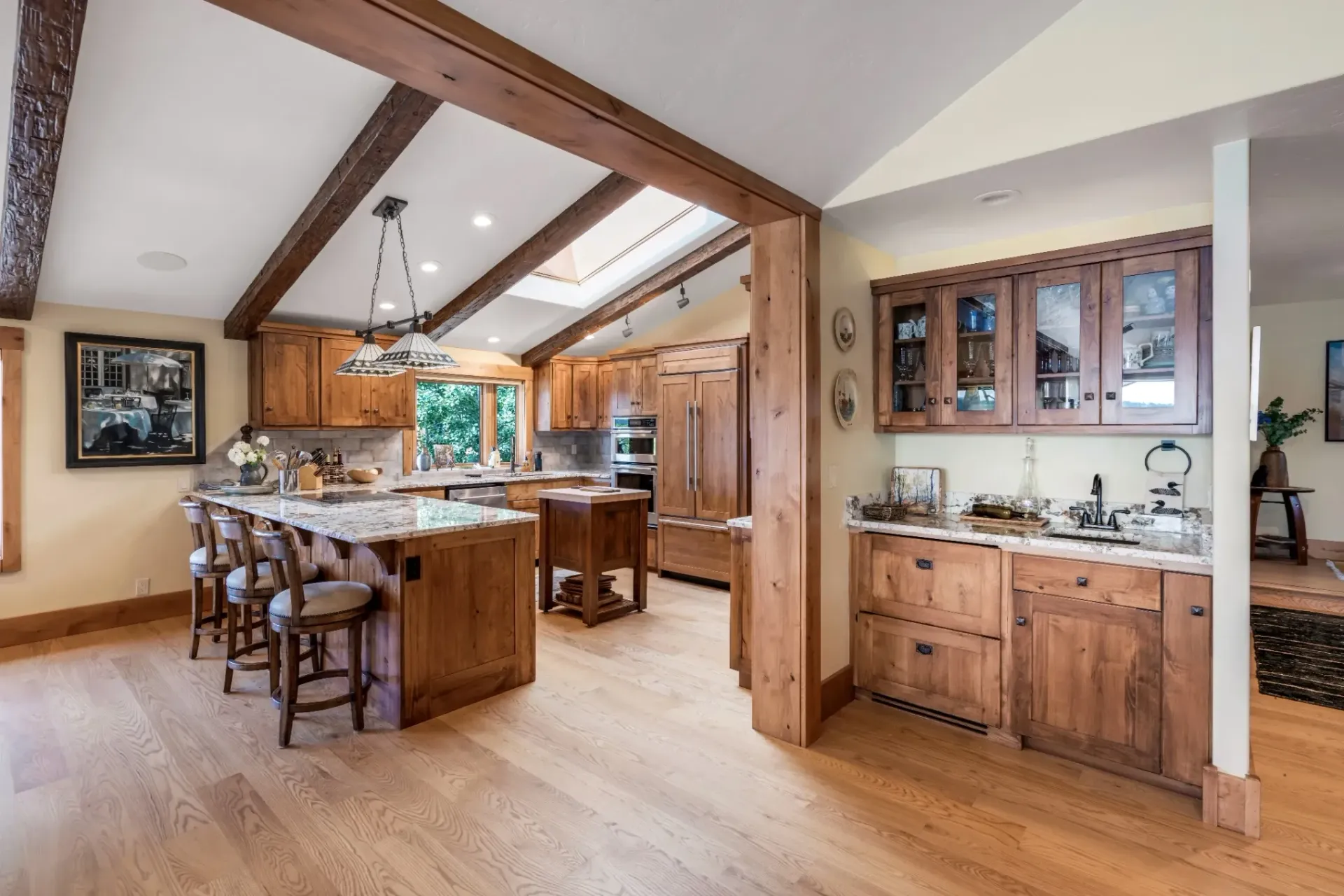 Wide-plank hardwood flooring in luxury great room