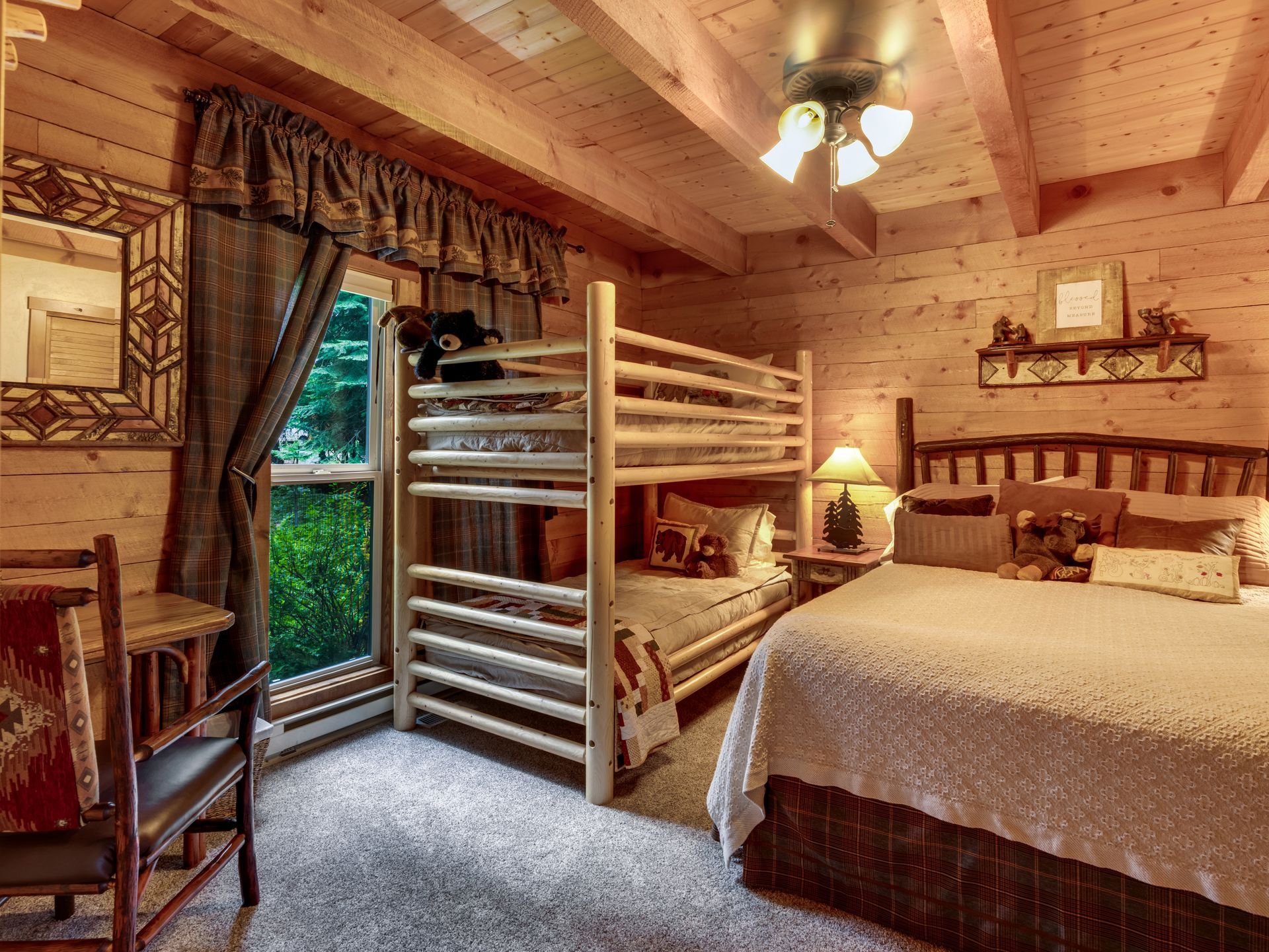 Luxury custom home exterior showcasing natural wood and stone in Idaho mountain setting