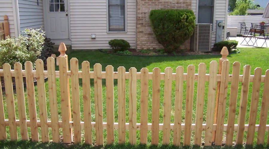 Wooden picket fence installed in a Gastonia NC backyard.