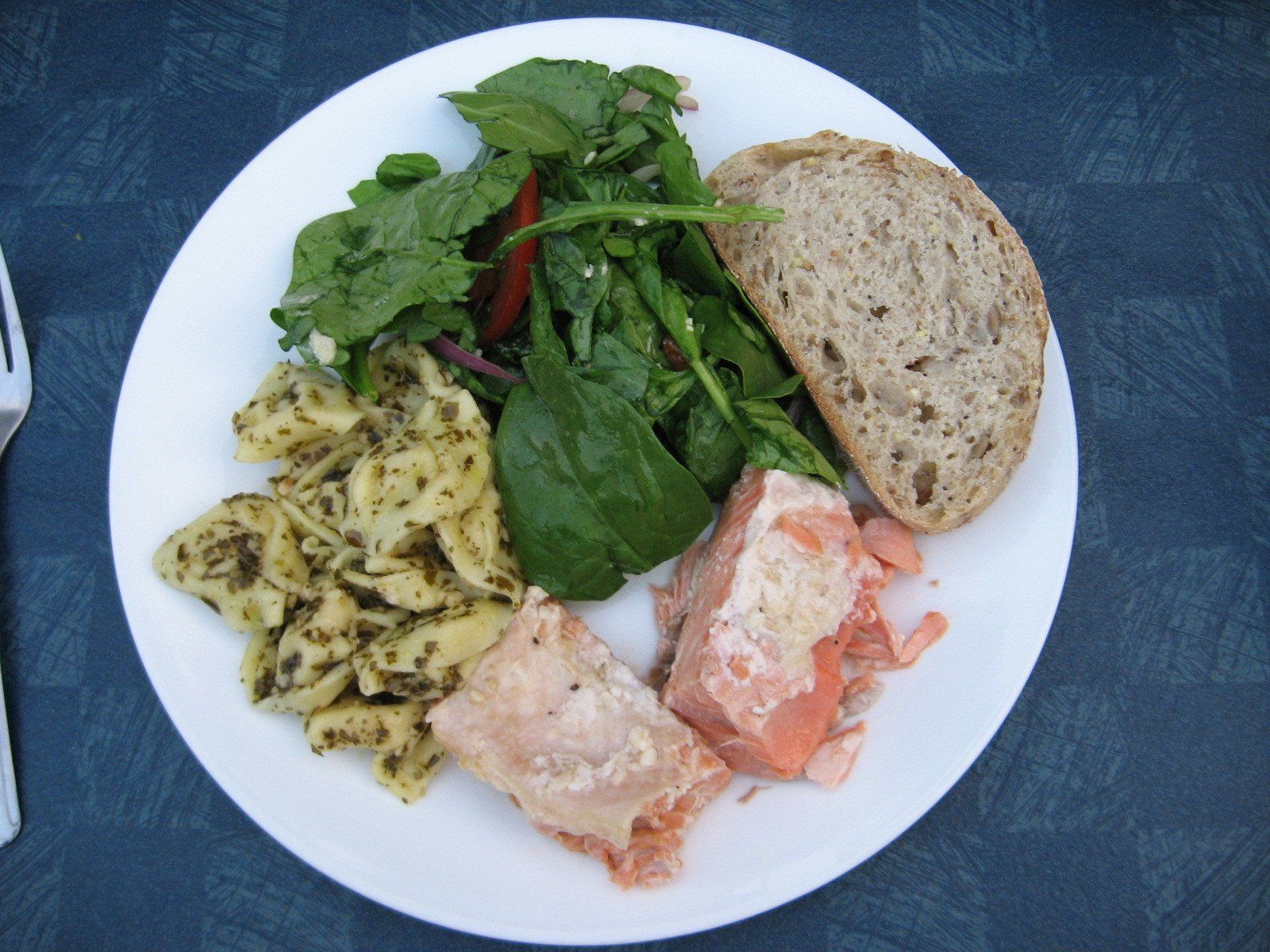 Grilled wild-caught salmon with pasta, spinach salad and artisan bread