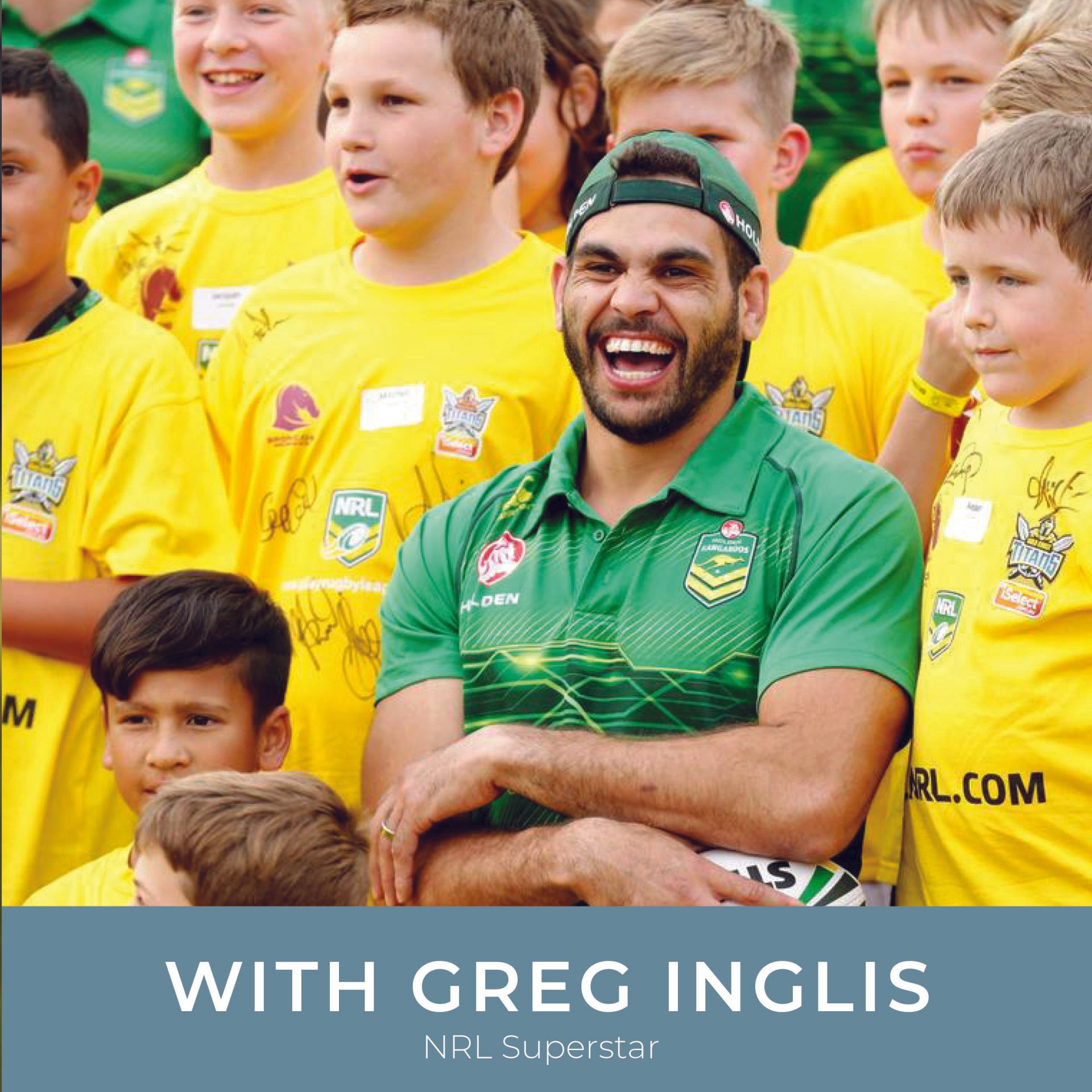 A man in a green shirt is smiling in front of a group of children