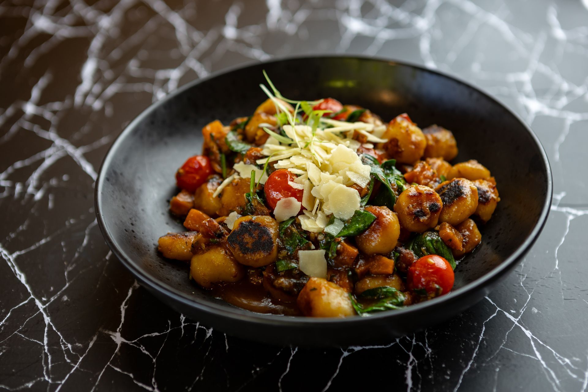 A close up of a bowl of food on a table.