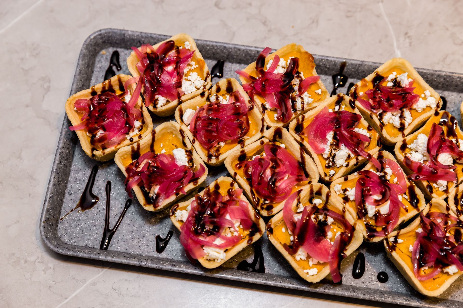 A close up of a tray of food on a table.
