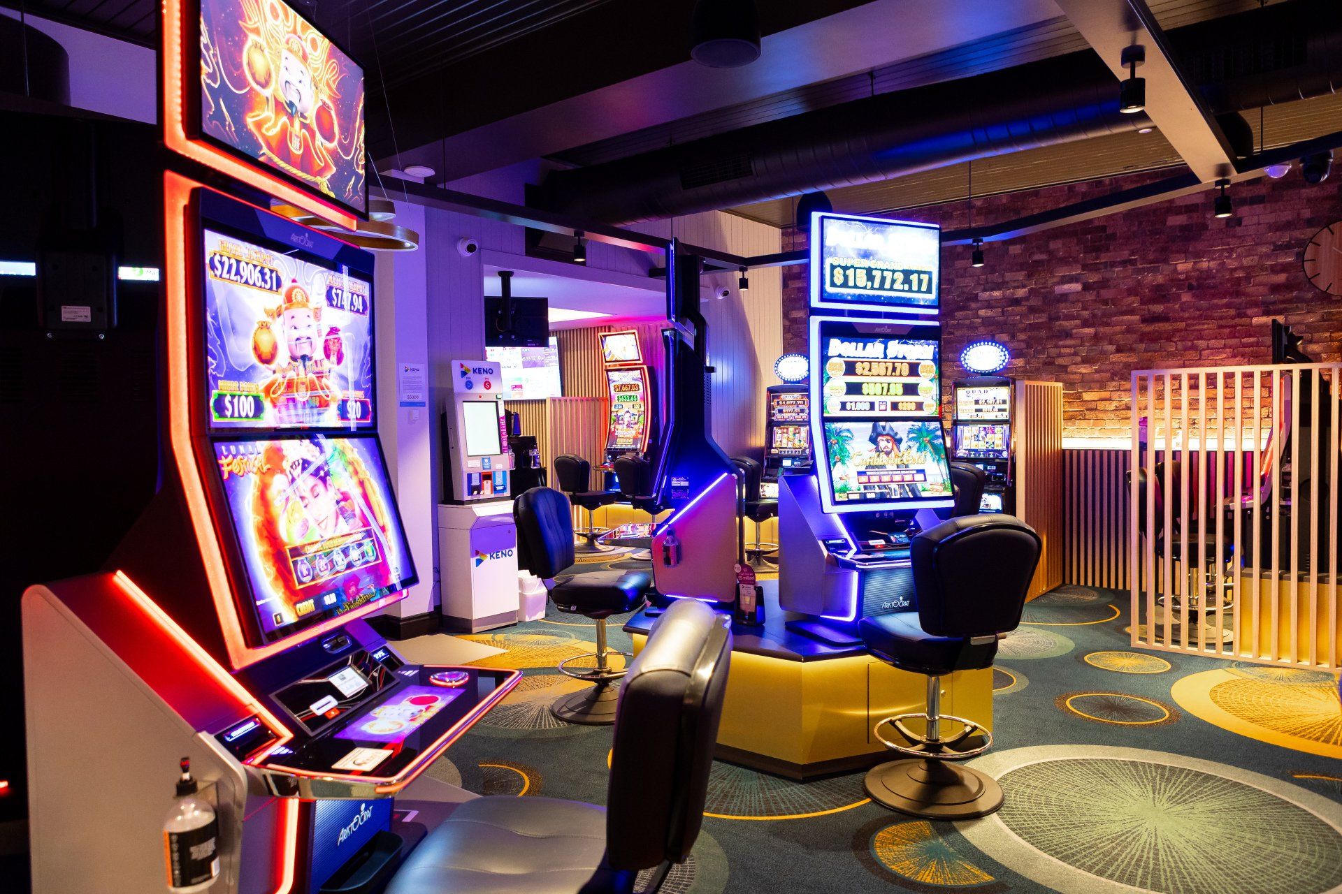 A room filled with lots of slot machines in a casino.