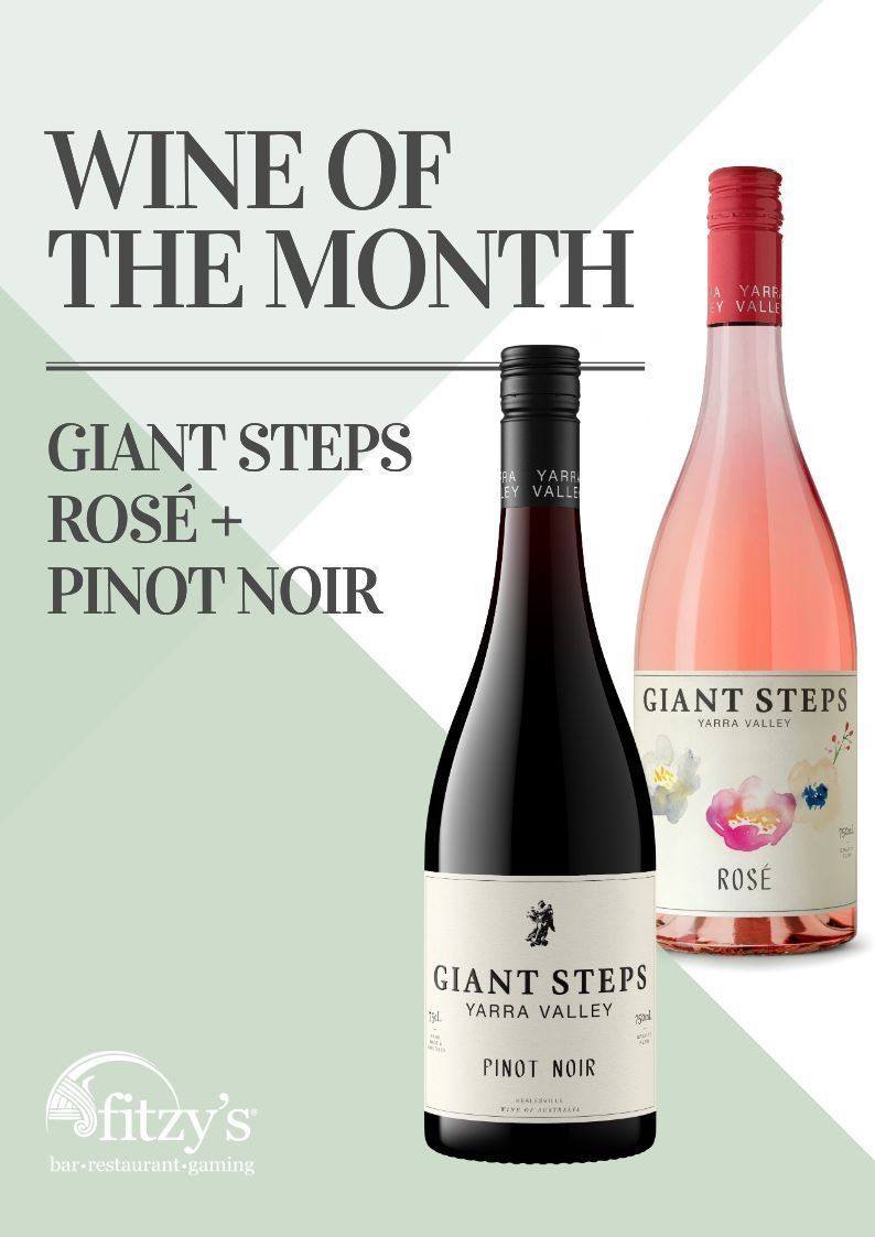 Two bottles of wine are on a poster that says wine of the month.