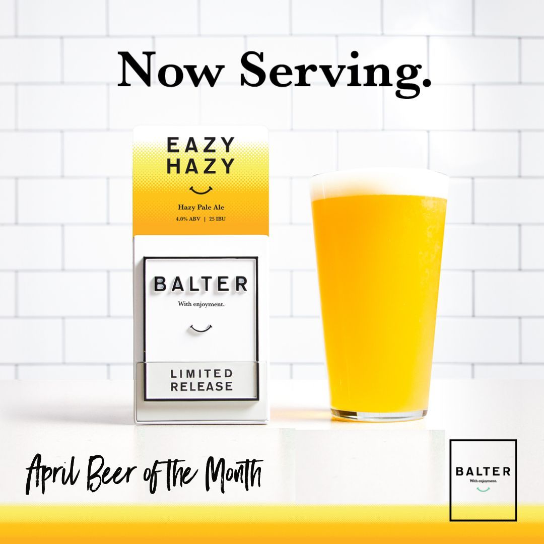 A box of balter eazy hazy next to a glass of beer.