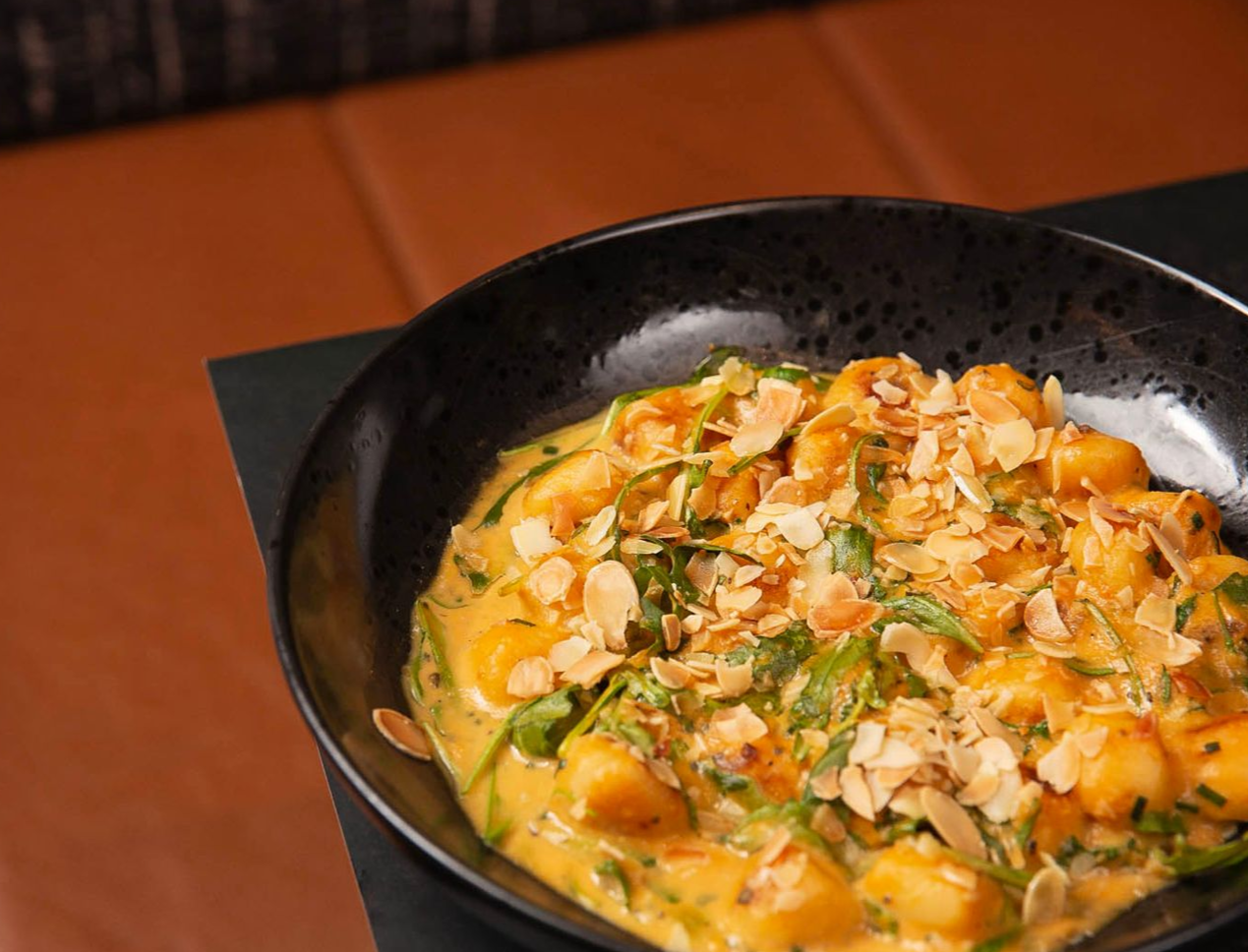 A close up of a bowl of food on a table.