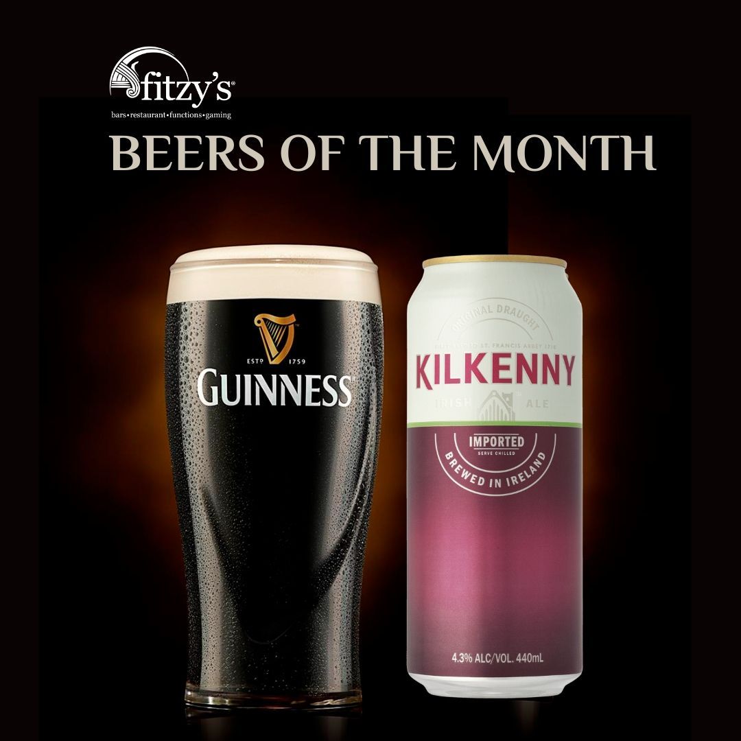 A glass of guinness next to a can of kilkenny beer