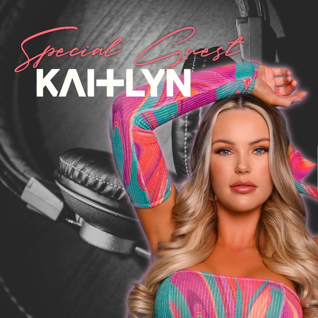 A woman in a colorful dress is wearing headphones.