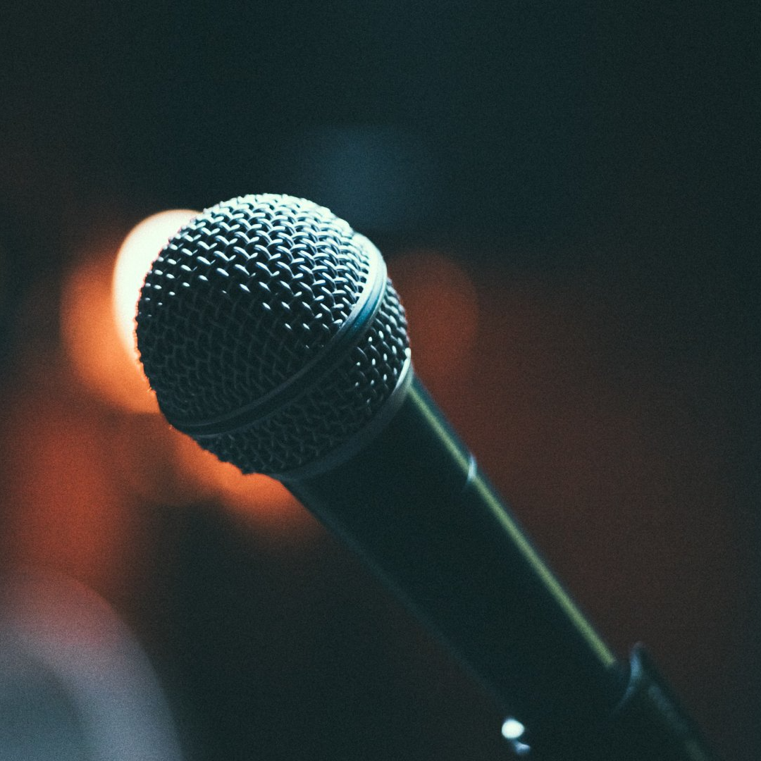 A close up of a microphone in a dark room