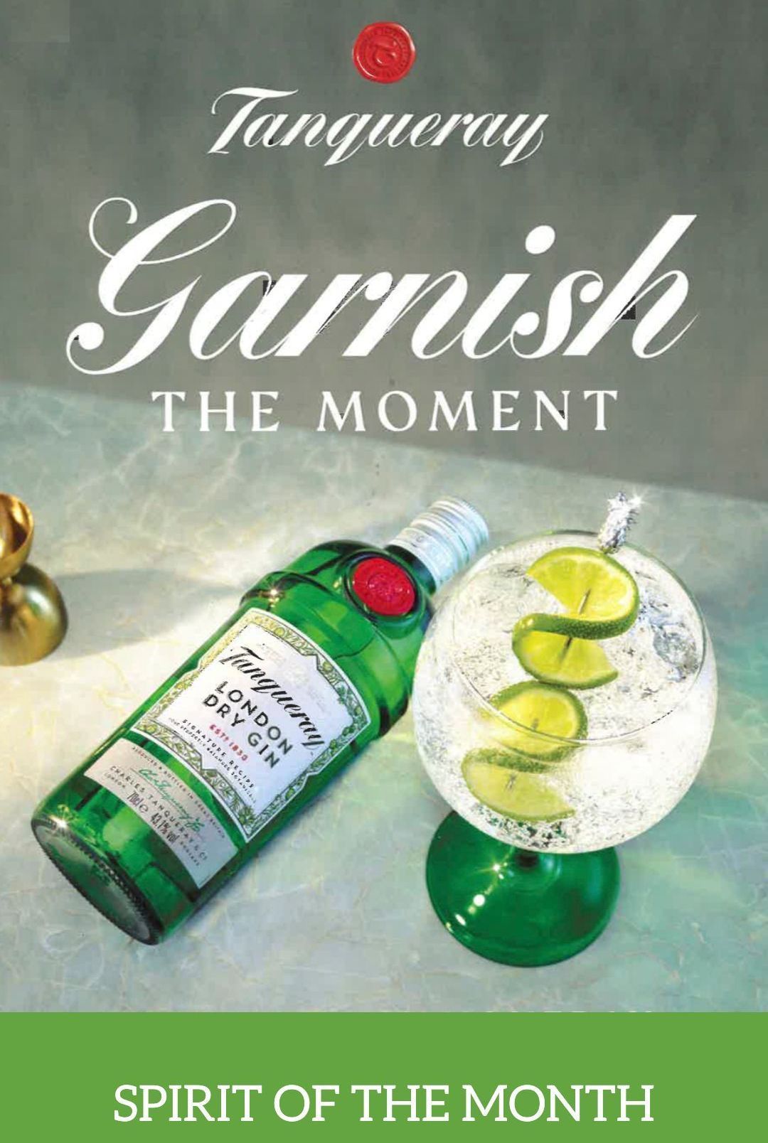 A bottle of gin and a glass of gin on a table.