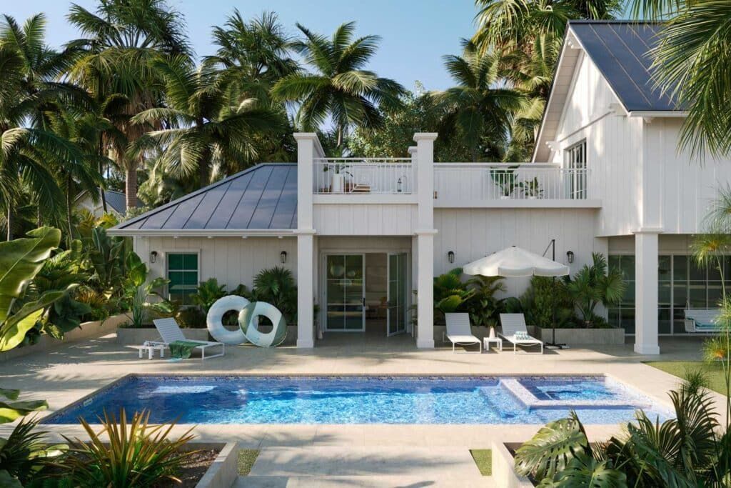 Modern white villa with palm trees, patio loungers, and a blue swimming pool in front