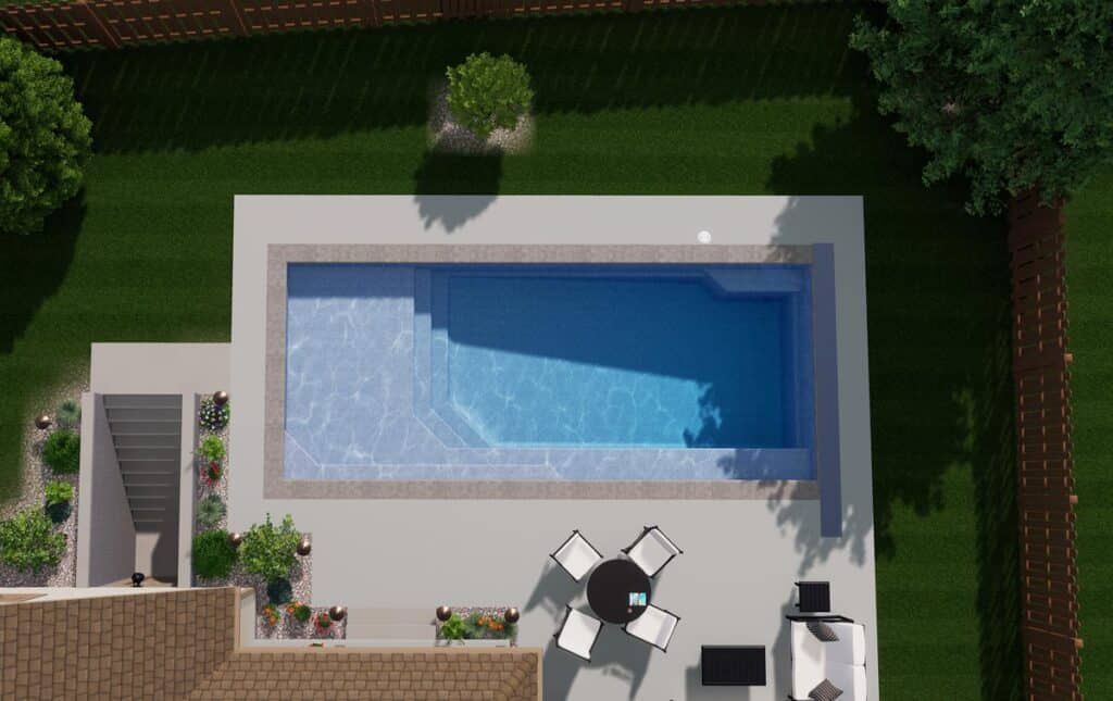 Overhead view of a rectangular backyard pool with white patio, lounge chairs, and green lawn surrounding it