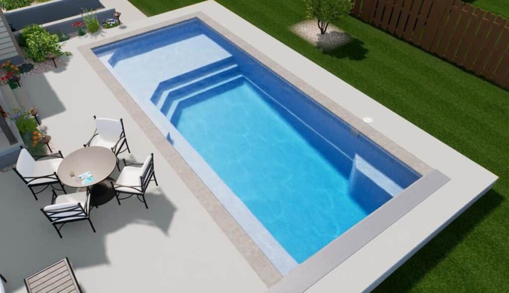 Modern backyard with a rectangular swimming pool, patio table and chairs, and green lawn.