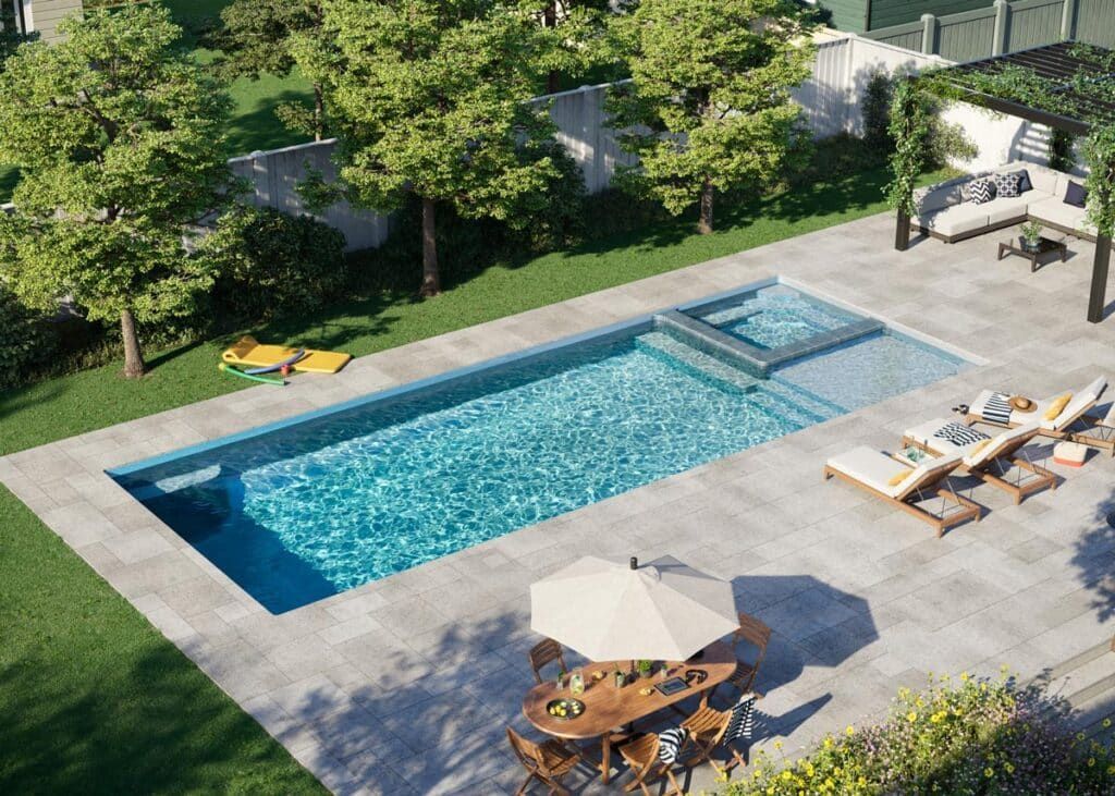 Backyard swimming pool with lounge chairs, patio seating, and surrounding trees