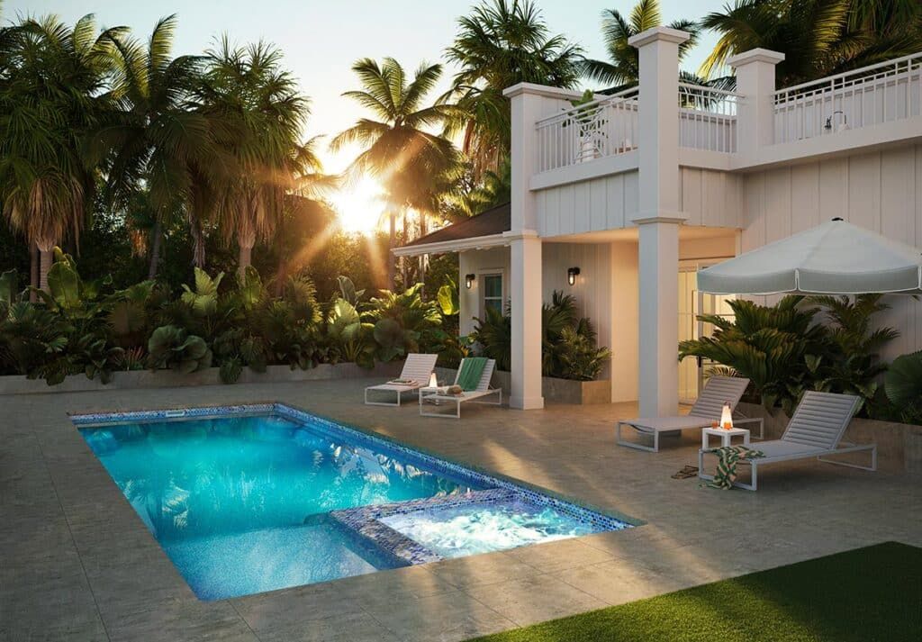 Luxury villa patio with lit pool, lounge chairs, umbrellas, and palm trees at sunset