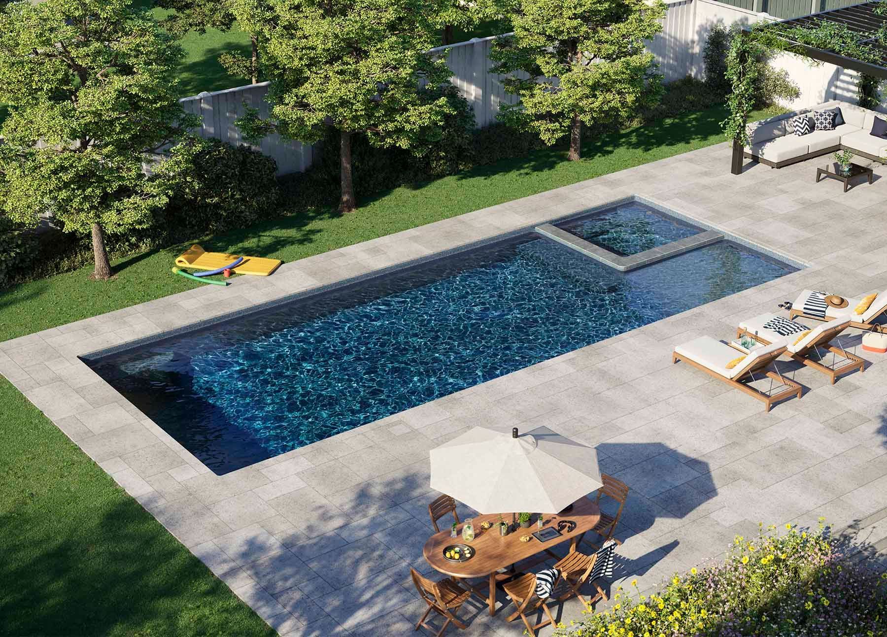 Backyard patio with rectangular pool, lounge chairs, umbrella, and surrounding trees