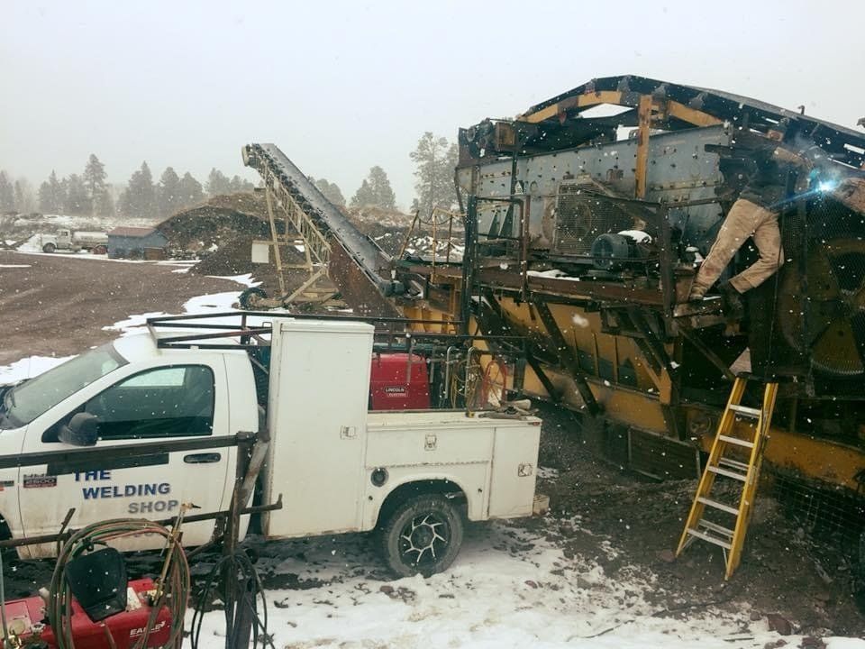 Workers Are Cutting Iron Plates — Kalispell, MT — The Welding Shop