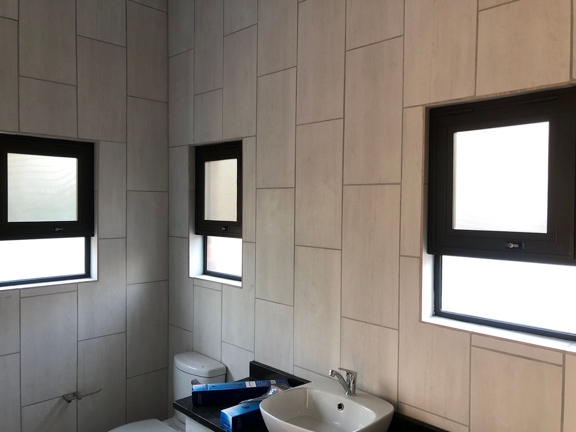 Flyscreens installed in a bathroom by SunShade in Pretoria & Joburg.