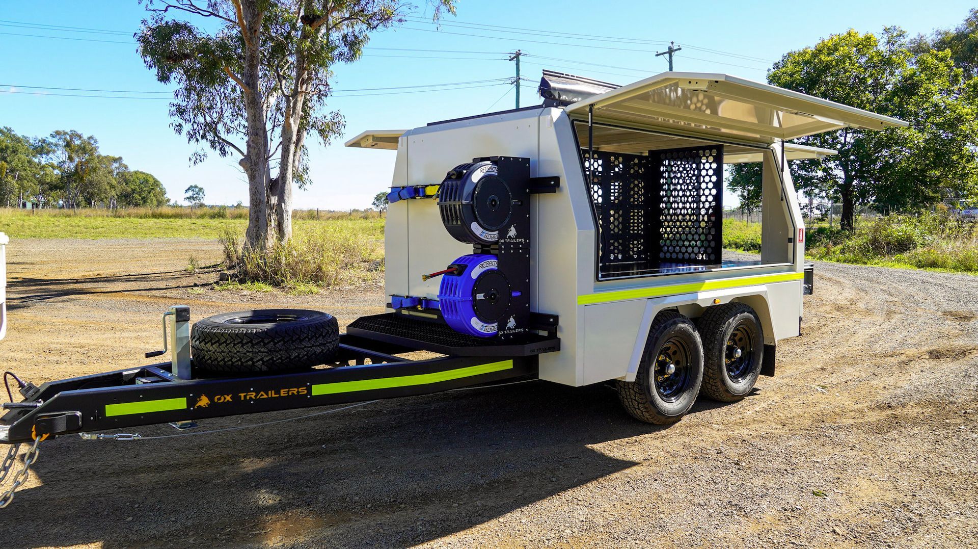 Reinforced side opening door on ox trailer service trailer, lockable and sealed for secure storage.