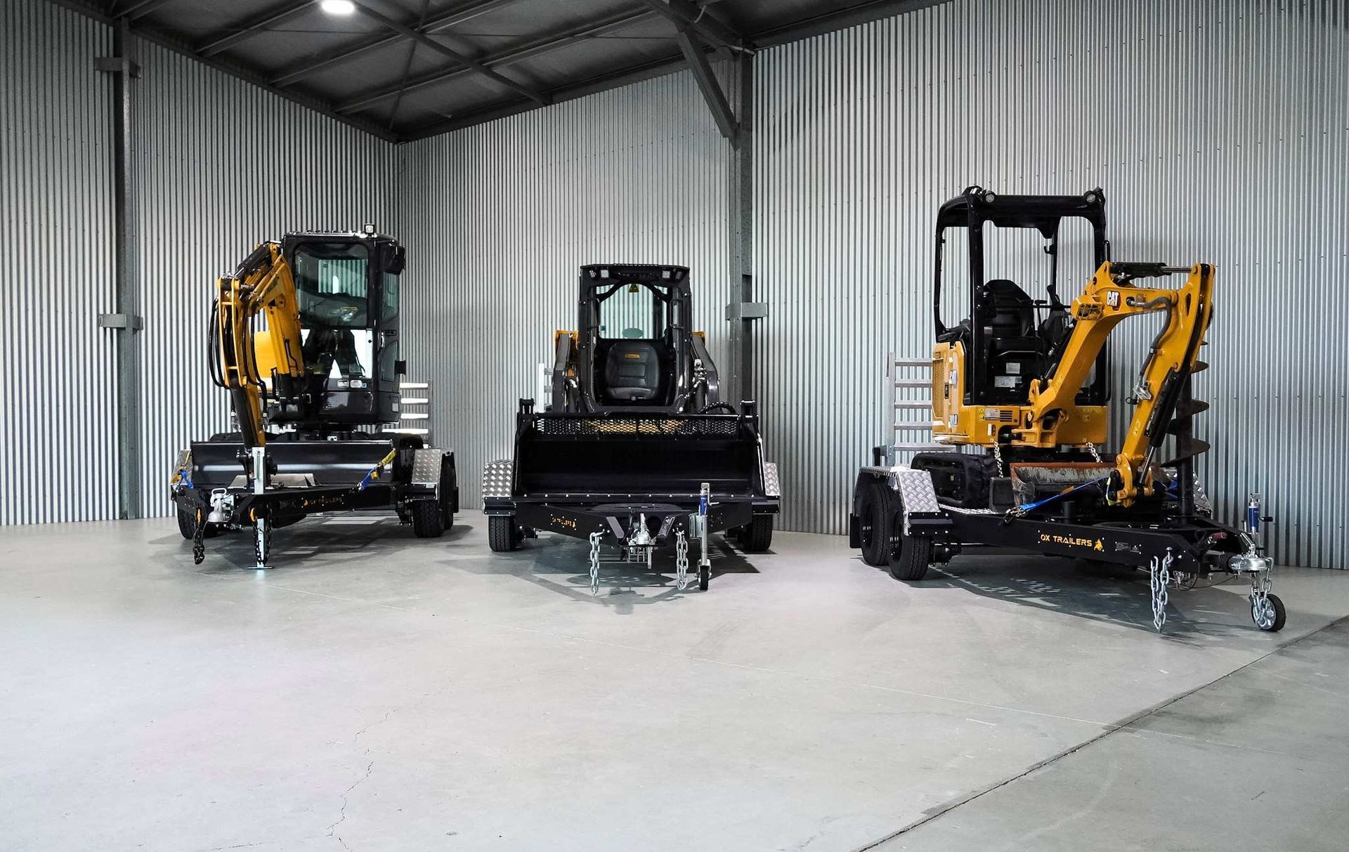 A heavy duty plant trailer delivering an excavator to a construction site. Built Tough Plant Trailers. Plant Trailers Built Tough
