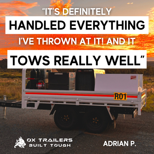 Mine site compliant flat top trailer  with toolboxes at mine site, described to tow really well by customer Platinum Fab + Weld.
