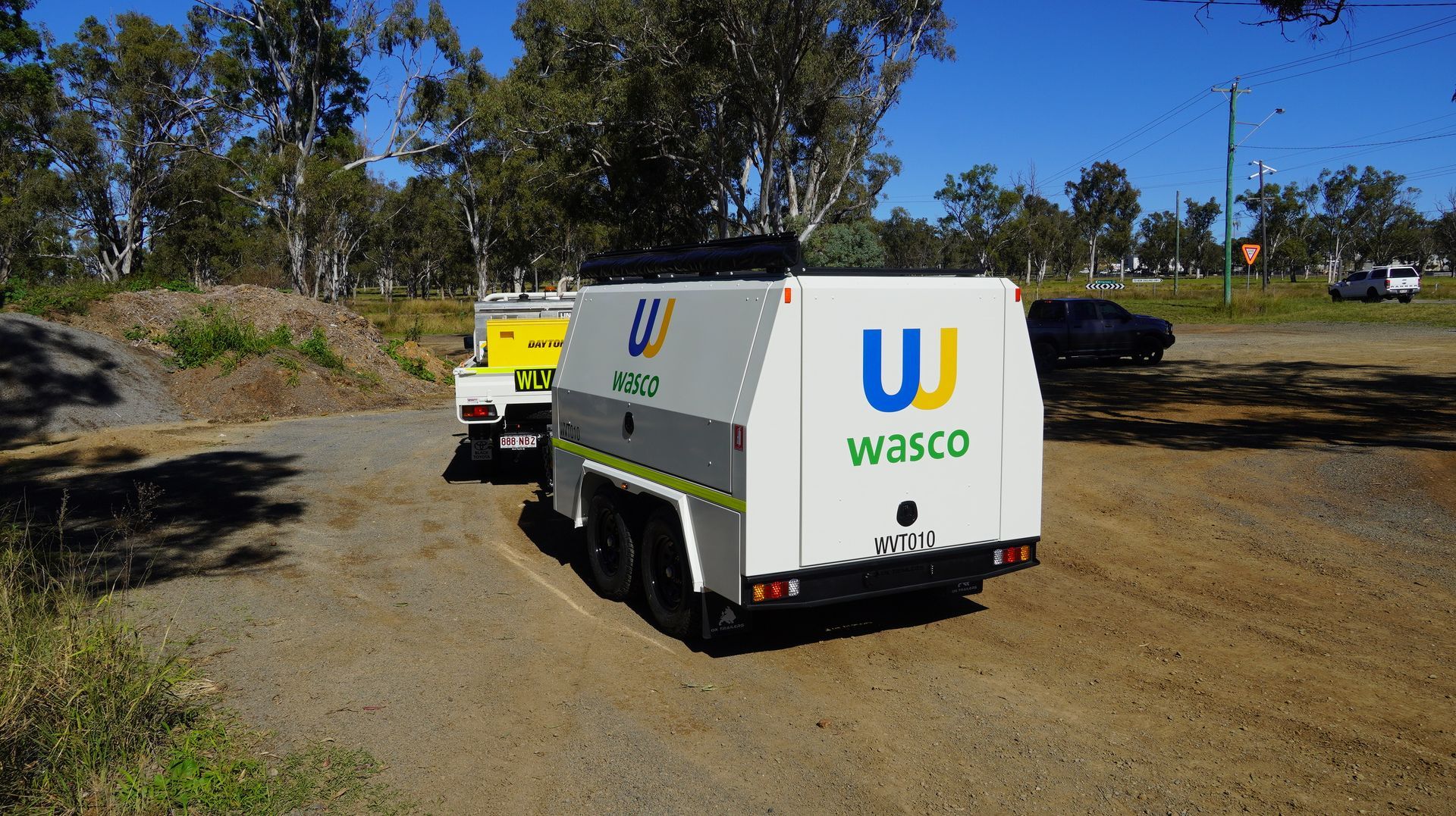 Custom built ox trailers service trailer for wsco australia on dirt road towed by a land cruiser