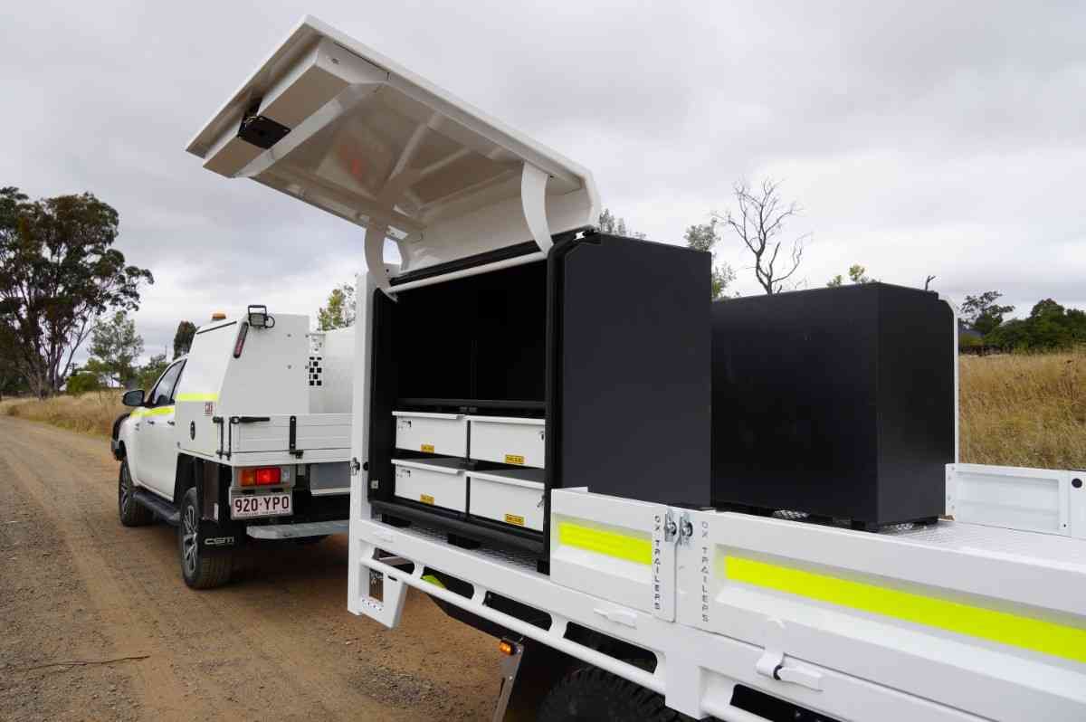 Field service toolboxes on a mine spec flat top trailer.