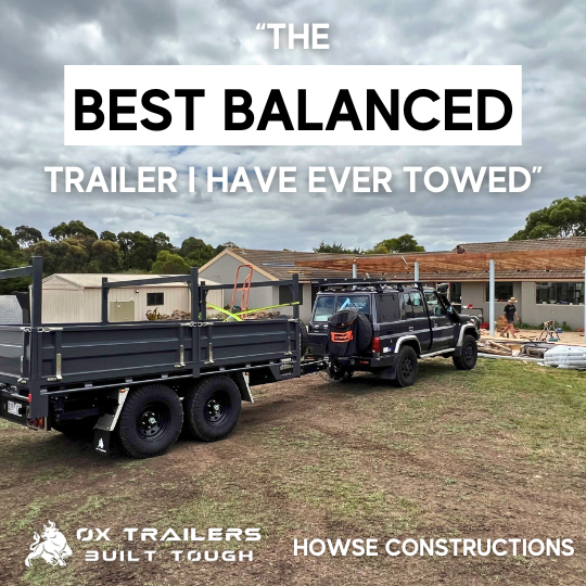 custom ox trailers built Black Tipper with a ladder racks at a construction site praised for being the best balanced trailer by House Constructions