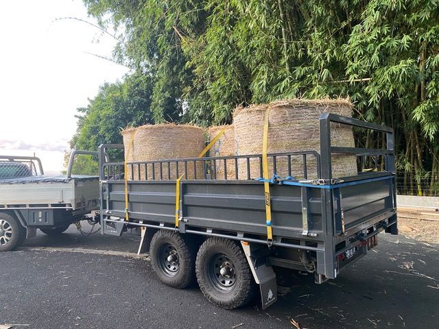 3-way tipping trailer with 450 dropsides and 250 SHS extensions loaded with 3 hay bales. 