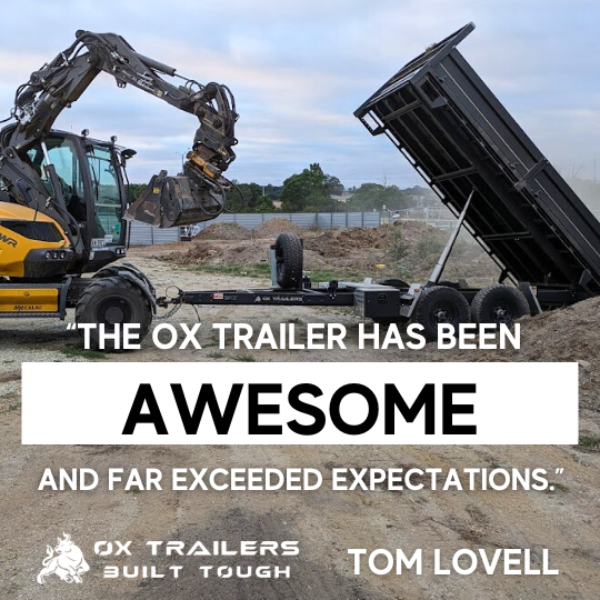 A heavy-duty rear tipper trailer by Ox Trailers is towed behind an excavator and described as awesome by owner Tom Lovell.