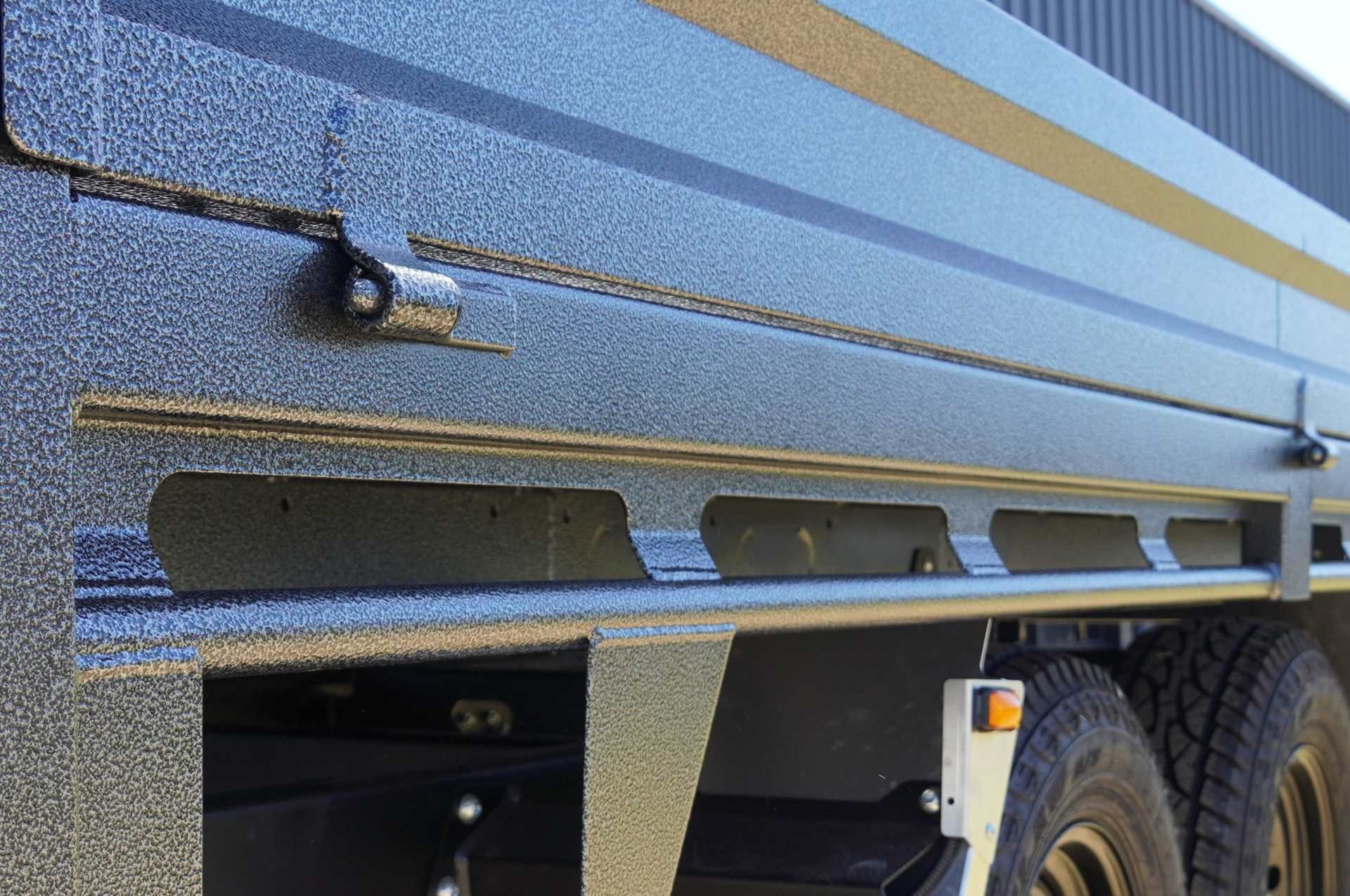 The rope rail of an ox trailer trade series flat top trailer.