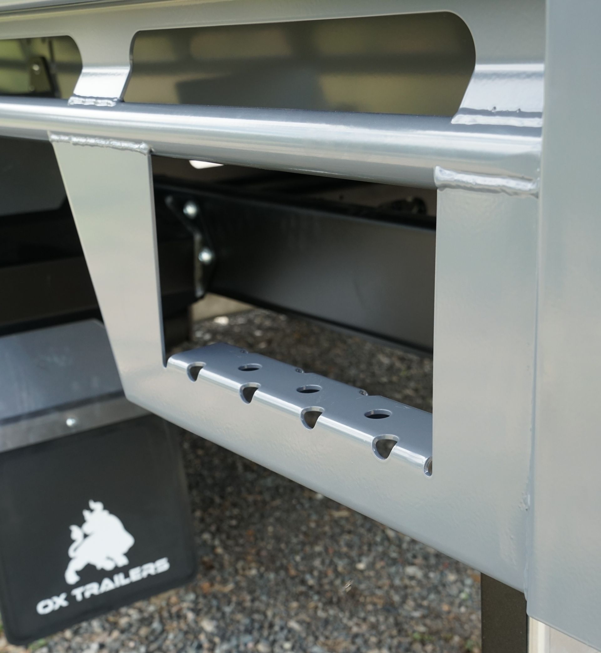 The rear side step of an ox trailer.