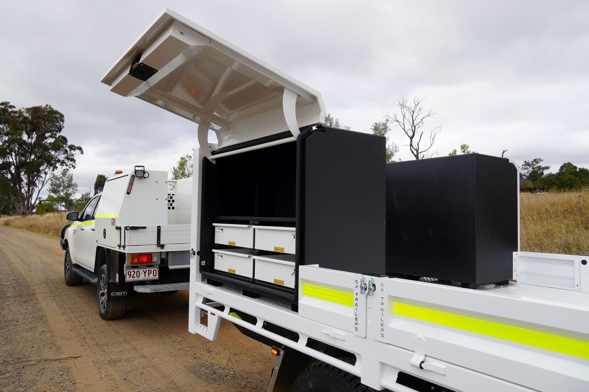 Field service toolboxes on a mine spec flat top trailer.