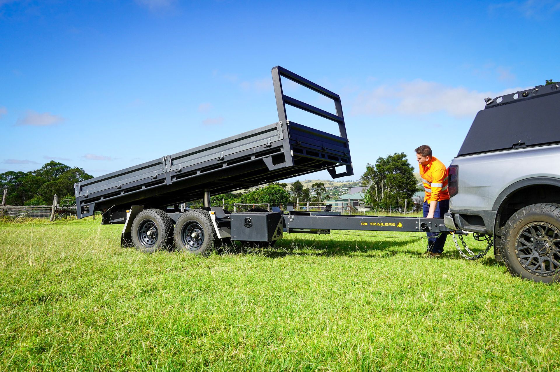 Charles Millar with his 4.2m x 2.1m Rear Tipper Ox Trailer in a feild.