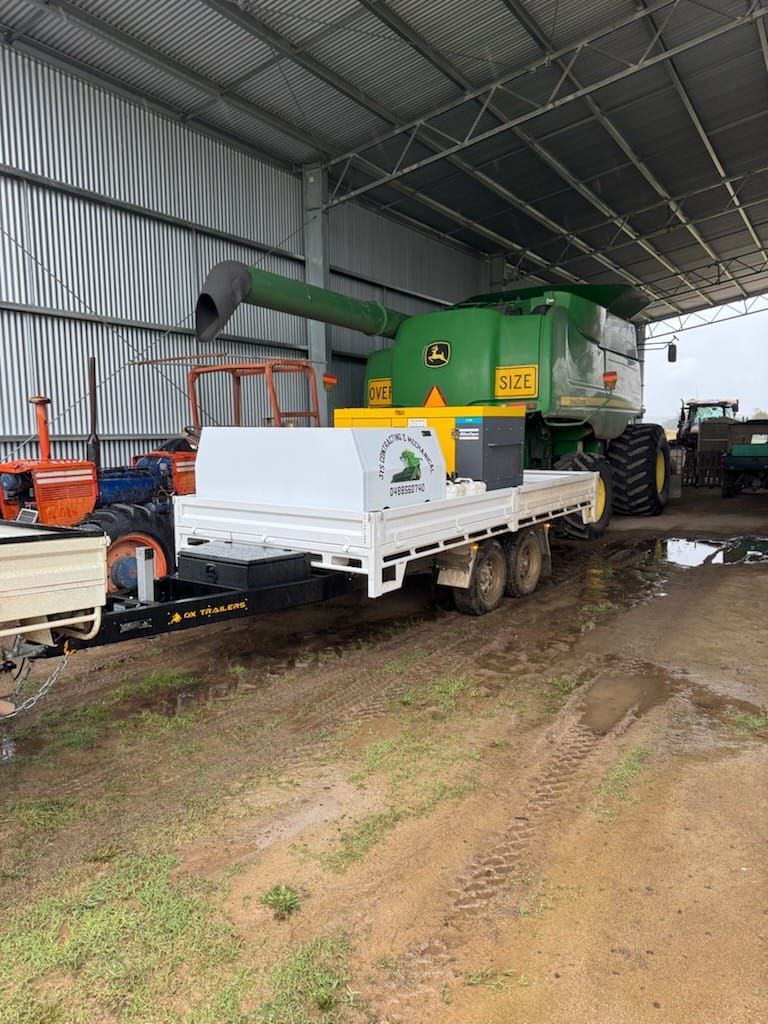 Heavy Duty Flat Top Trailer with toolboxes for mobile welder on site.