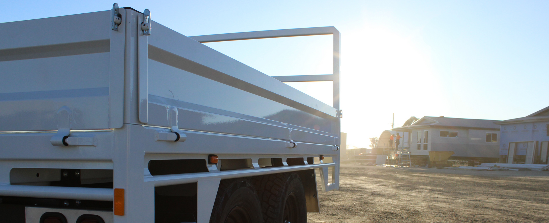 Flat Top Trailer at Construction site with RHS Dropsides