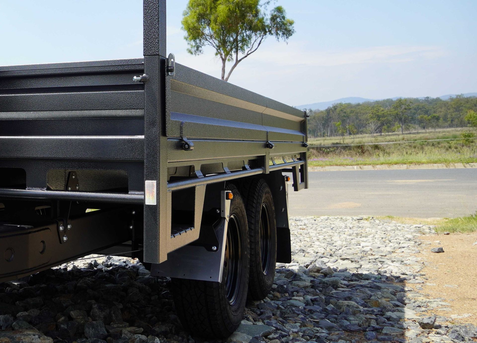 The side of a trade series flat top trailer, depicting the height.