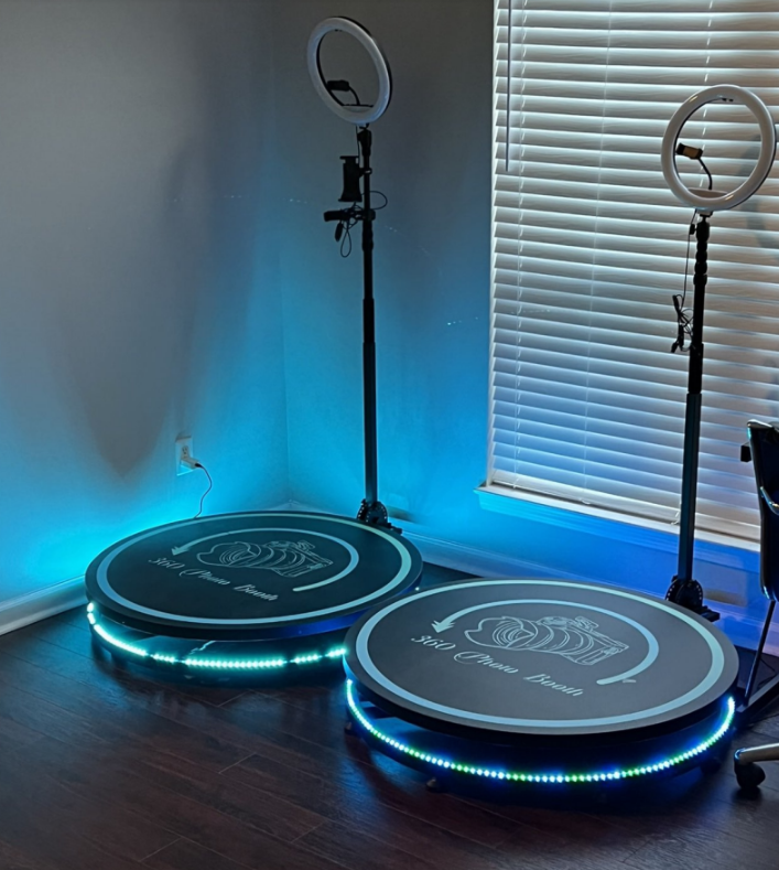 Two LED-lit round pads in a room corner beside ring lights and blinds
