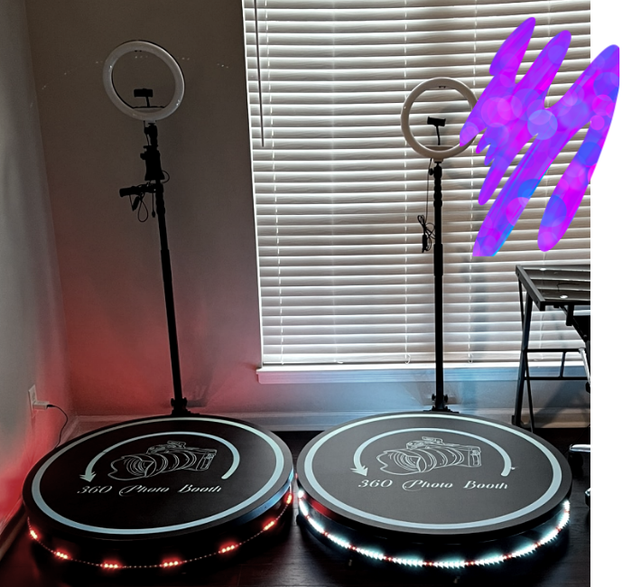 Two illuminated drum practice pads beneath ring lights by a window with blinds