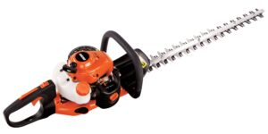 A close up of a hedge trimmer on a white background.