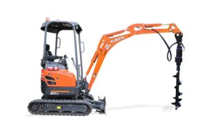 A small orange and black excavator with a drill attached to it.