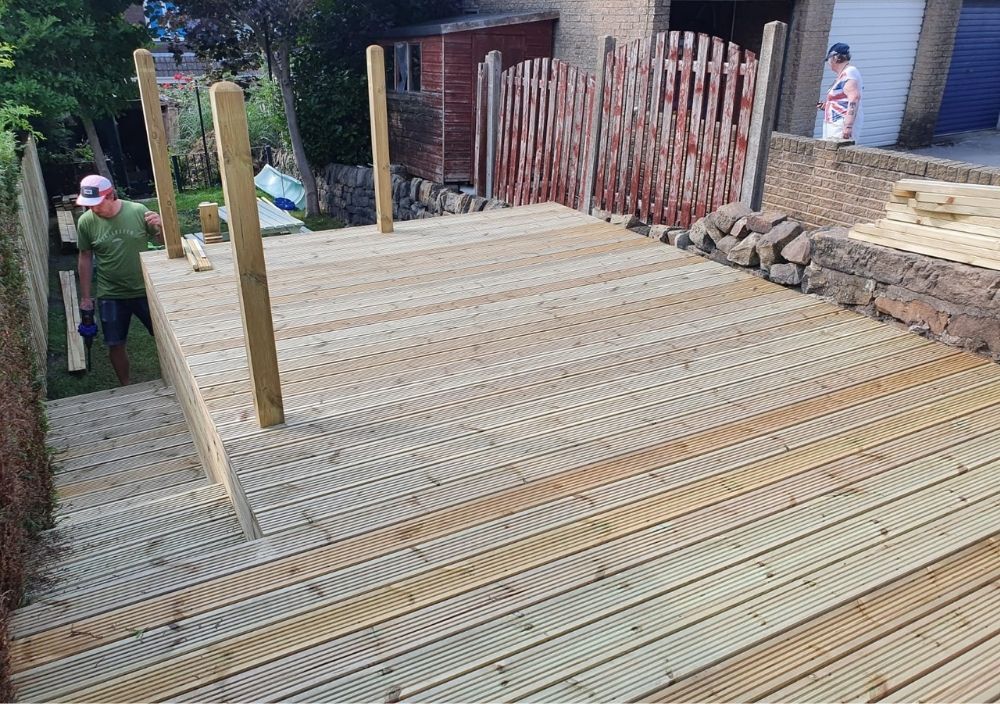 Zest Decking Mexborough - brown composite decking fitted around a hot tub