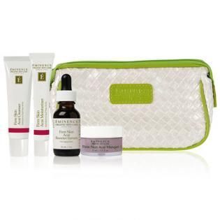 Skincare gift set with tubes, serum bottle, cream jar, and white zip pouch with green trim