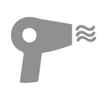Gray hair dryer with wavy air lines blowing to the right
