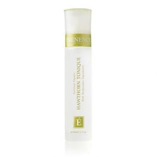 White Clinique serum bottle with green accents and gold label on a plain background