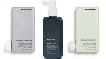 Three skincare bottles: silver, dark gray with pump, and pale green on white background