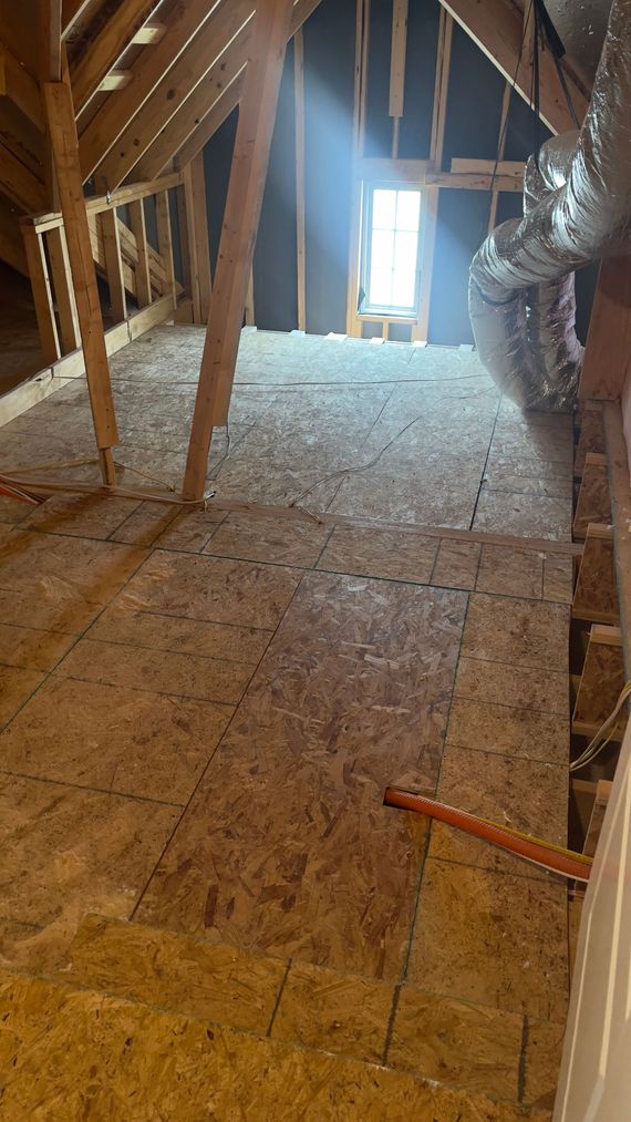 There is a window in the attic that is being built.