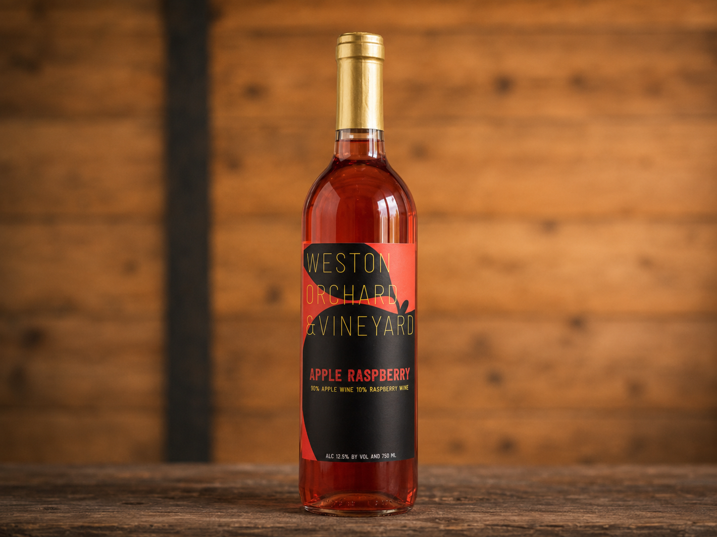 Three bottles of weston vineyard wine are on a table